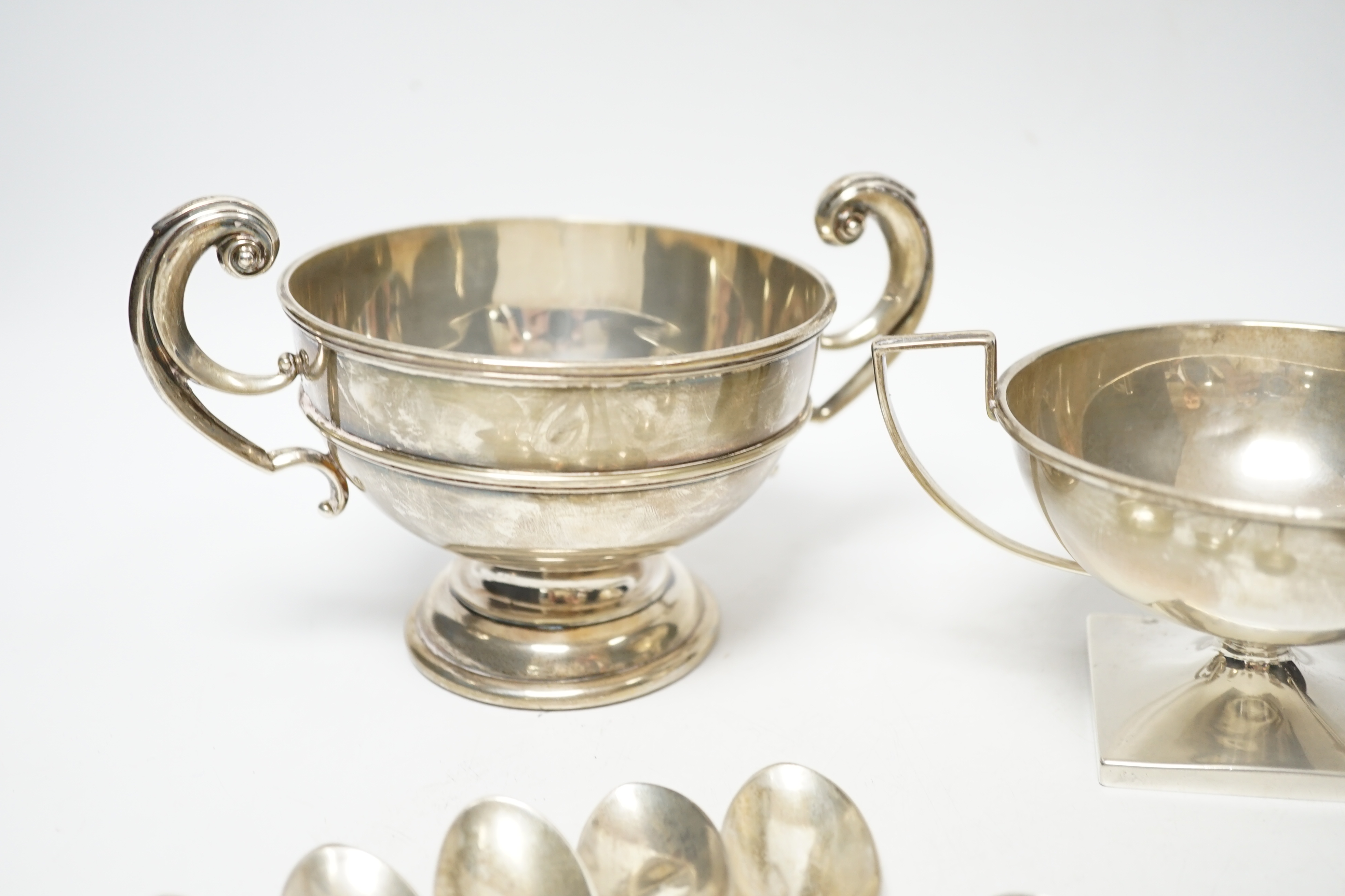 An Edwardian silver two handled bowl, Chester, 1902, diameter 10.4cm, a sterling bowl, a pair of engraved silver tub salts and matching salt spoons, Mappin & Webb, Sheffield, 1908 and a set of five silver teaspoons.
